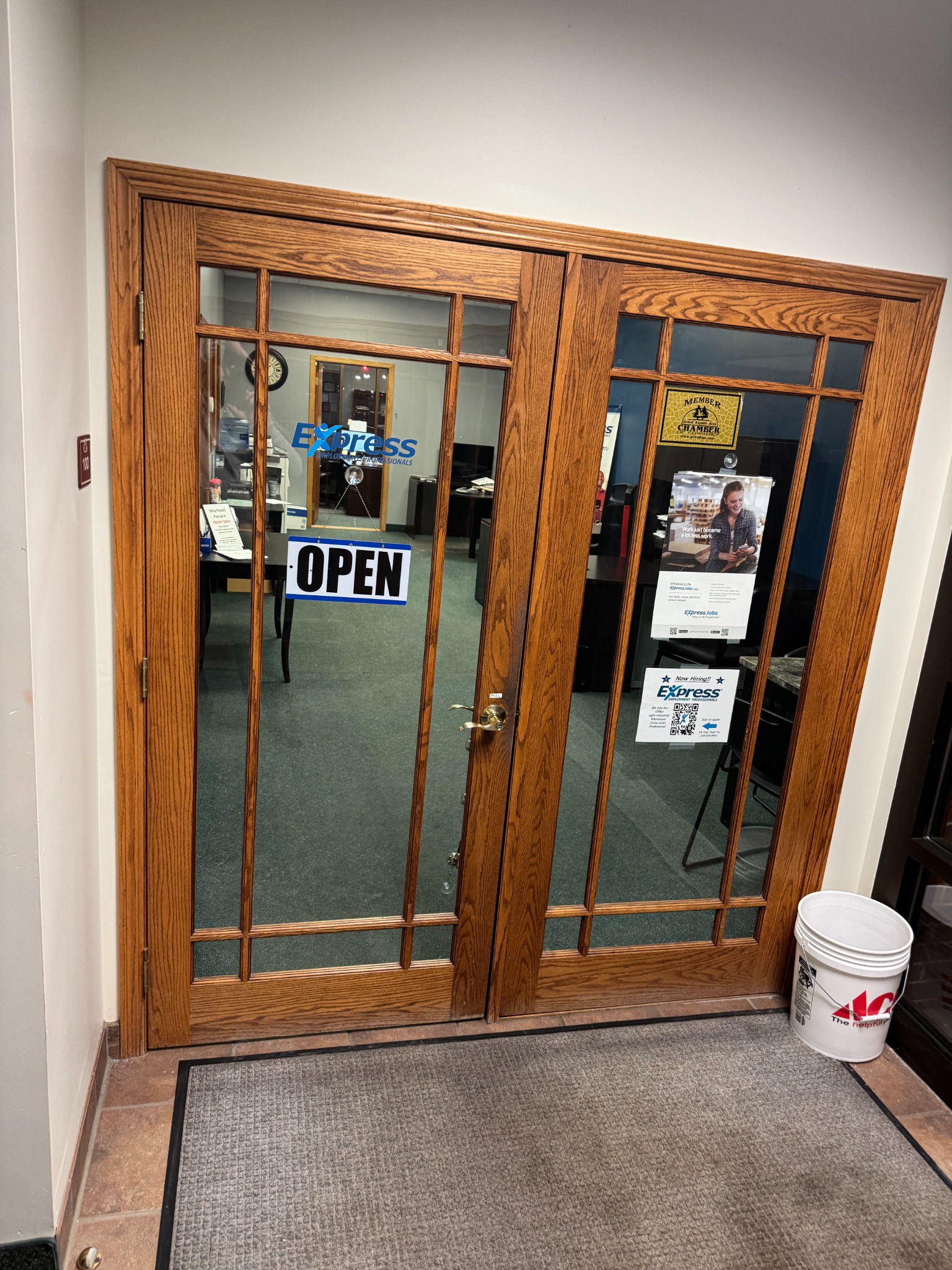 Wood and glass doors marked Express at our office entrance